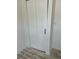 Hallway closet features paneled doors, black hardware and laminate flooring at 5562 Old Tampa Hwy, Davenport, FL 33896