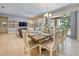 Open floor plan with dining area, living room, and sliding glass doors that bring the outside in at 6086 Broad Oak Dr, Davenport, FL 33837