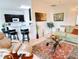 Open living area features a view of the kitchen, and a comfortable seating arrangement at 650 Portofino Drive, Poinciana, FL 34759