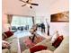 Spacious living room with patio access offering seamless indoor-outdoor flow and natural light at 650 Portofino Drive, Poinciana, FL 34759