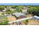 Aerial view of fenced in backyard with pool enclosure and brick home on a large lot at 724 Knob Hill Cir, Kissimmee, FL 34744