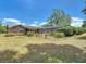 Lovely brick home backyard with screened pool enclosure, and lush landscaping at 724 Knob Hill Cir, Kissimmee, FL 34744