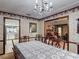 Elegant dining room with floral wallpaper and direct access to other rooms at 724 Knob Hill Cir, Kissimmee, FL 34744