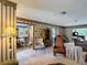Spacious living room showing access to the dining room, kitchen, and rear Gathering room at 724 Knob Hill Cir, Kissimmee, FL 34744