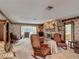 Gathering room with a brick fireplace, comfortable seating, and access to the outdoors at 724 Knob Hill Cir, Kissimmee, FL 34744