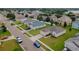 Aerial view of a residential neighborhood with well-maintained lawns and tree-lined streets at 724 Lake Cummings Blvd, Lake Alfred, FL 33850