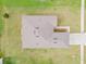 Aerial view of roof and gutters with lawn and landscaping at 724 Lake Cummings Blvd, Lake Alfred, FL 33850