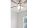 Bedroom featuring a ceiling fan with wooden blades and glass light fixture at 724 Lake Cummings Blvd, Lake Alfred, FL 33850