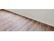 Close-up of laminate flooring with baseboard trim at 724 Lake Cummings Blvd, Lake Alfred, FL 33850