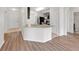 Bright kitchen featuring a breakfast bar and modern appliances at 724 Lake Cummings Blvd, Lake Alfred, FL 33850