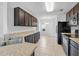 Well-lit kitchen with sleek countertops, and stainless steel appliances at 724 Lake Cummings Blvd, Lake Alfred, FL 33850