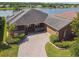 Stunning lakefront home with a brick driveway and well-maintained landscaping at 759 Glendora Rd, Poinciana, FL 34759