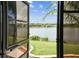 Gorgeous view of a peaceful lake framed by lush greenery and clear skies at 759 Glendora Rd, Poinciana, FL 34759