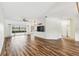 Spacious living area with wood floors and sliding glass doors to lanai at 759 Glendora Rd, Poinciana, FL 34759
