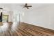 Expansive living room featuring new floors, white walls and crown molding at 759 Glendora Rd, Poinciana, FL 34759