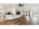 Living area with tile floors opening to kitchen and additional living space at 759 Glendora Rd, Poinciana, FL 34759