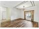 Bright living room showcasing new floors and an elegant pendant light at 759 Glendora Rd, Poinciana, FL 34759