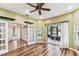 Bright living room with sliding doors and plank flooring at 759 Glendora Rd, Poinciana, FL 34759