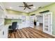 Office space with built-in shelving and an entrance to the kitchen at 759 Glendora Rd, Poinciana, FL 34759
