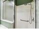 Shower featuring tile walls, grab bar and shower caddy at 759 Glendora Rd, Poinciana, FL 34759