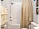 This bathroom features a tub, shower head, and decorative shower curtain at 932 Wild Date Ln, Lake Mary, FL 32746