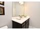 Modern bathroom features a single vanity, white countertop, and decorative mirror at 932 Wild Date Ln, Lake Mary, FL 32746
