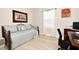 Well-lit spare bedroom or office featuring a daybed and a desk at 932 Wild Date Ln, Lake Mary, FL 32746