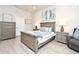 Serene bedroom featuring a well-made bed, nightstands with lamps, and neutral decor at 932 Wild Date Ln, Lake Mary, FL 32746