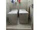 Bright laundry room featuring a washer, dryer, and wire rack shelf at 932 Wild Date Ln, Lake Mary, FL 32746
