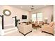 Cozy living room featuring modern furnishings, natural light, and a stylish decorative mirror at 932 Wild Date Ln, Lake Mary, FL 32746