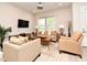 Inviting living room with stylish seating, modern decor, and a view of the natural light at 932 Wild Date Ln, Lake Mary, FL 32746