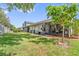 Spacious backyard with a screened-in patio offering a seamless transition to indoor/outdoor living at 98 Lakepointe Cir, Kissimmee, FL 34743