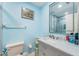 Bathroom with neutral-toned walls, a toilet, and sink at 98 Lakepointe Cir, Kissimmee, FL 34743