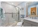 Bathroom featuring a glass enclosed shower, marble countertop, and modern fixtures at 98 Lakepointe Cir, Kissimmee, FL 34743