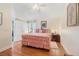 Comfortable bedroom with wood floors, a plush bed, and a closet at 98 Lakepointe Cir, Kissimmee, FL 34743