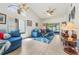Open living room with tile flooring, high ceilings, bright windows, and comfortable seating perfect for entertaining at 98 Lakepointe Cir, Kissimmee, FL 34743