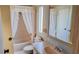 Bathroom showcasing a bath, commode and sink at 509 Tivoli Park Dr, Davenport, FL 33897
