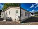The property shows an AC unit and neatly maintained features, showcasing practical design and curb appeal at 509 Tivoli Park Dr, Davenport, FL 33897