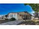 Inviting single-story home with covered porch and driveway on a sunny day at 509 Tivoli Park Dr, Davenport, FL 33897