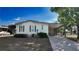 Cozy single-story home with a carport, set amidst a lush, green landscape and blue sky at 509 Tivoli Park Dr, Davenport, FL 33897
