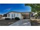 Well maintained single-story home featuring a covered carport and charming curb appeal at 509 Tivoli Park Dr, Davenport, FL 33897