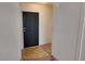 Entryway showcasing hardwood transitioning to carpet and a solid black door at 509 Tivoli Park Dr, Davenport, FL 33897
