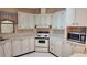 Well-organized kitchen with white cabinetry, appliances, and functional layout at 509 Tivoli Park Dr, Davenport, FL 33897