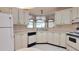 Clean kitchen featuring modern white appliances, countertops, and ample cabinet space at 509 Tivoli Park Dr, Davenport, FL 33897