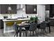 Dining room area featuring a sleek dining table with seating for six adjacent to the kitchen at 1007 Wisteria Way, Dundee, FL 33838