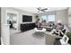 Comfortable loft space with modern furnishings, TV, and access to a bedroom at 1007 Wisteria Way, Dundee, FL 33838