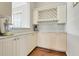 Butler's pantry with a wine rack, countertop, and storage at 1021 Castle Pines Ct, Reunion, FL 34747