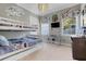 Whimsical 'Star Wars' themed room with bunk beds, desk and playful decor at 1021 Castle Pines Ct, Reunion, FL 34747