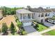 Beautiful two-story home features a two-car garage and a balcony at 1021 Castle Pines Ct, Reunion, FL 34747