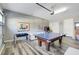 Game room with a ping pong table, foosball table, and arcade games at 1021 Castle Pines Ct, Reunion, FL 34747